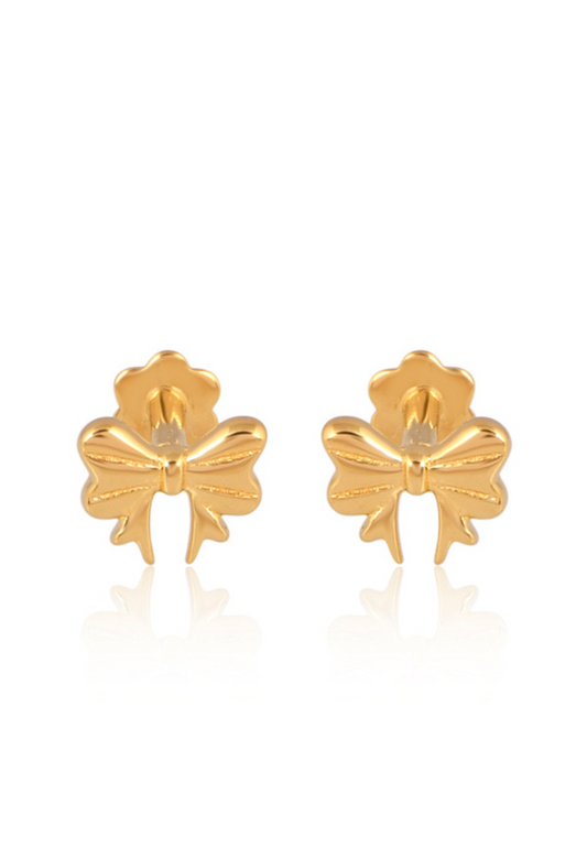 Gold bow-shaped earrings on a white background