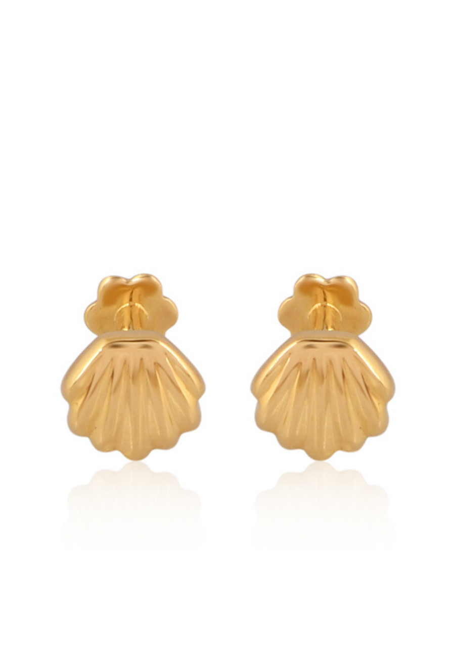 Pair of gold shell-shaped earrings on a white background