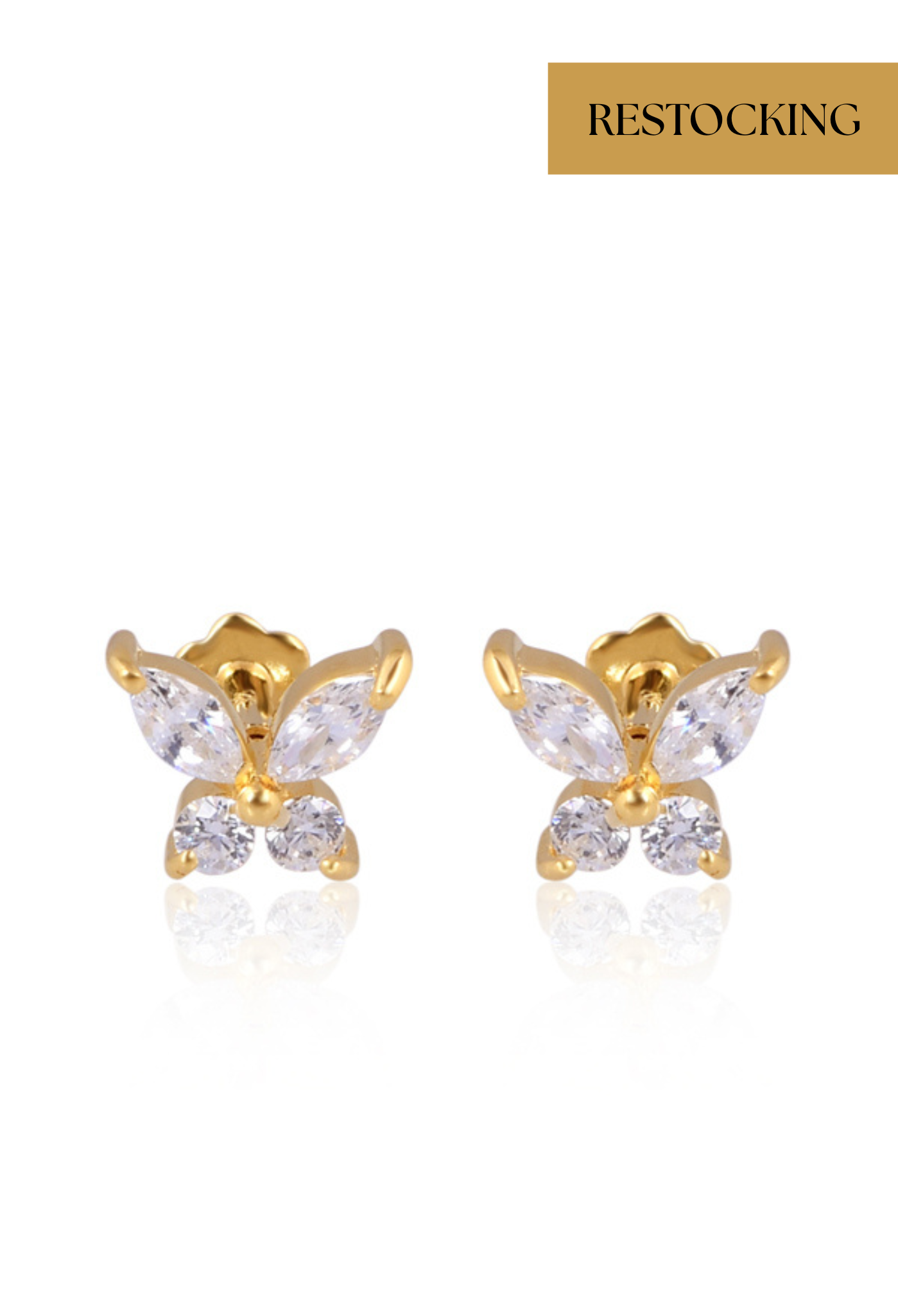 Gold butterfly-shaped earrings with clear gemstones on a white background, labeled 'Restocking'.